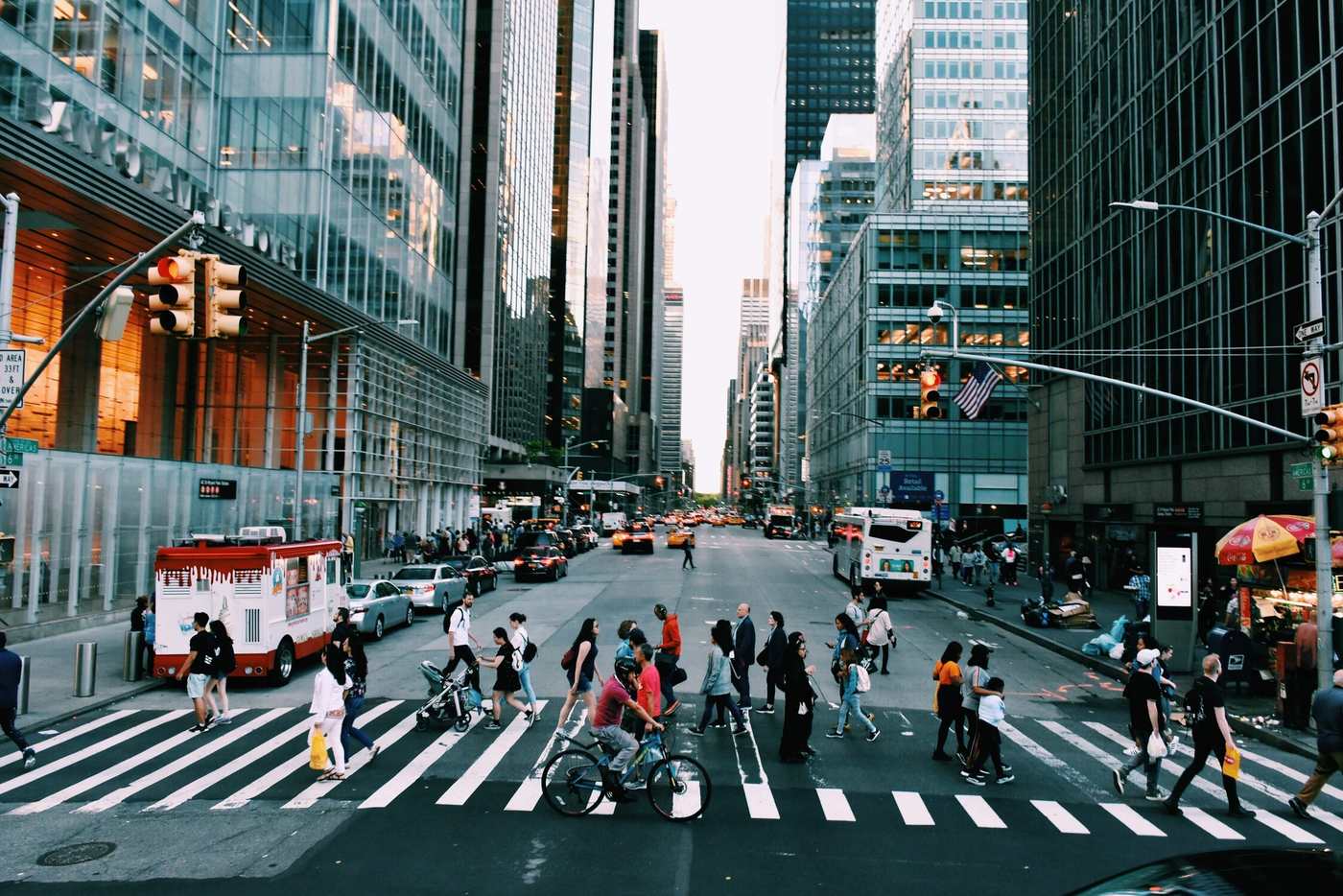 People crossing a city intersection together from every direction